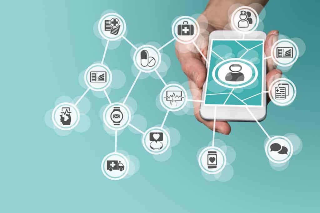 Digital and mobile healthcare concept with hand holding smart phone
