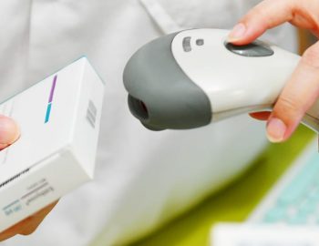 pharmacist,scanning,barcode,of,medicine,drug,in,a,pharmacy,drugstore pharmacist,scanning,barcode,of,medicine,drug,in,a,pharmacy,drugstore